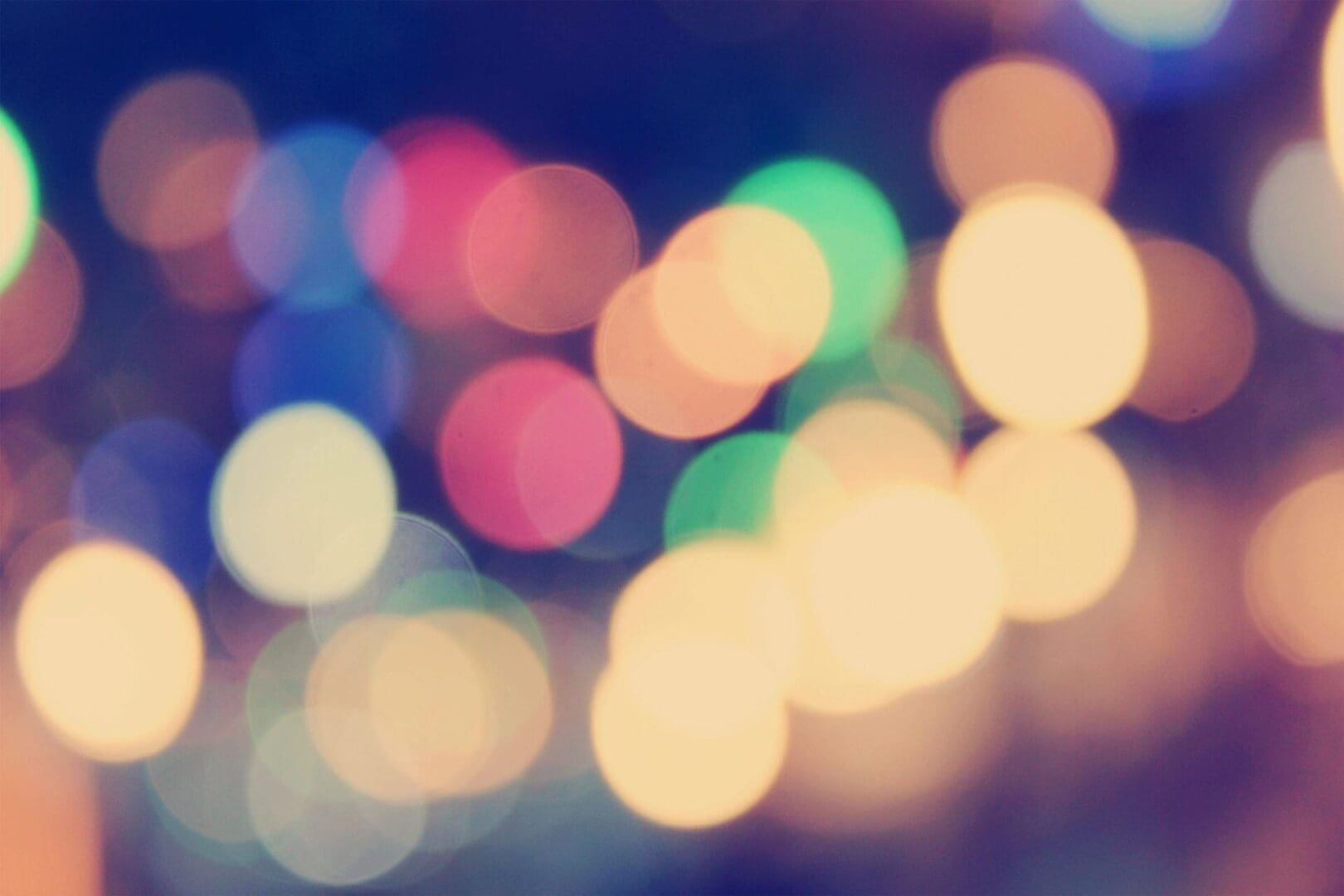 A soft-focused image featuring colorful bokeh lights.