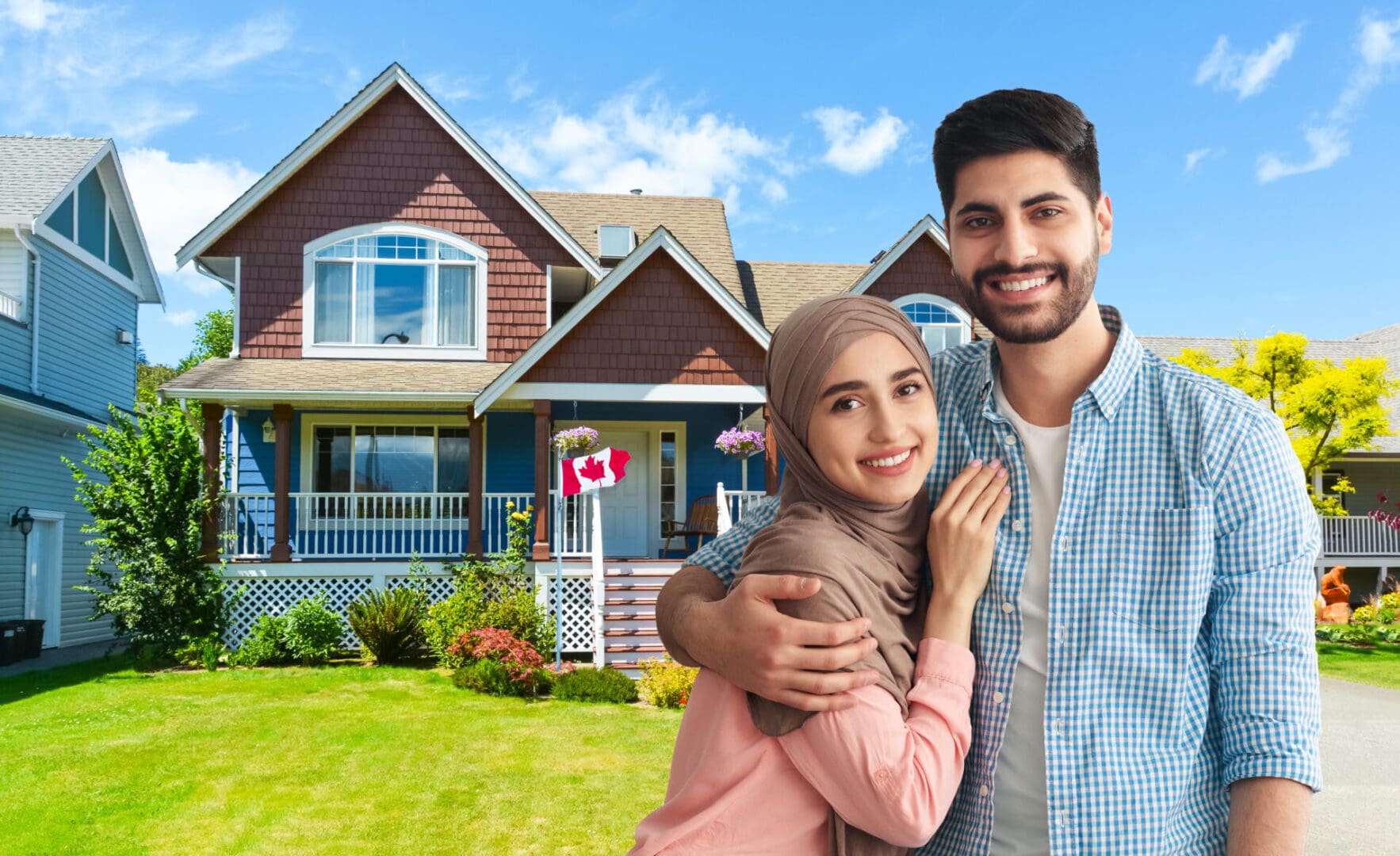 A smiling couple embracing in front of a suburban house, purchased through Islamic financing in Canada.