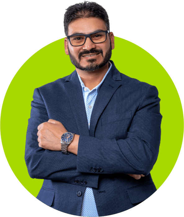 Confident professional businessman with crossed arms against a green circular background.