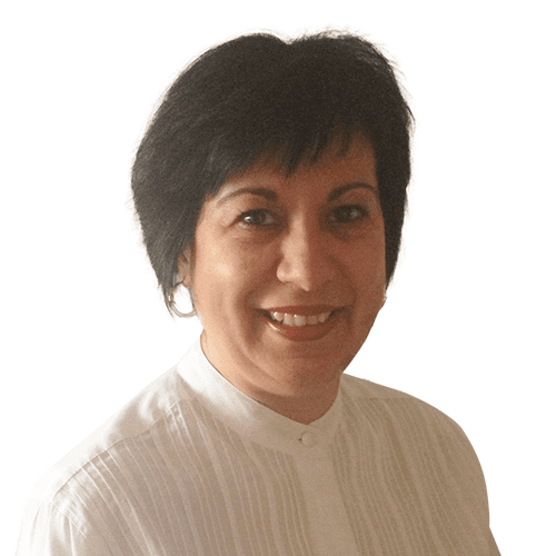 Woman with short black hair smiling at the camera, wearing a preferred white blouse.