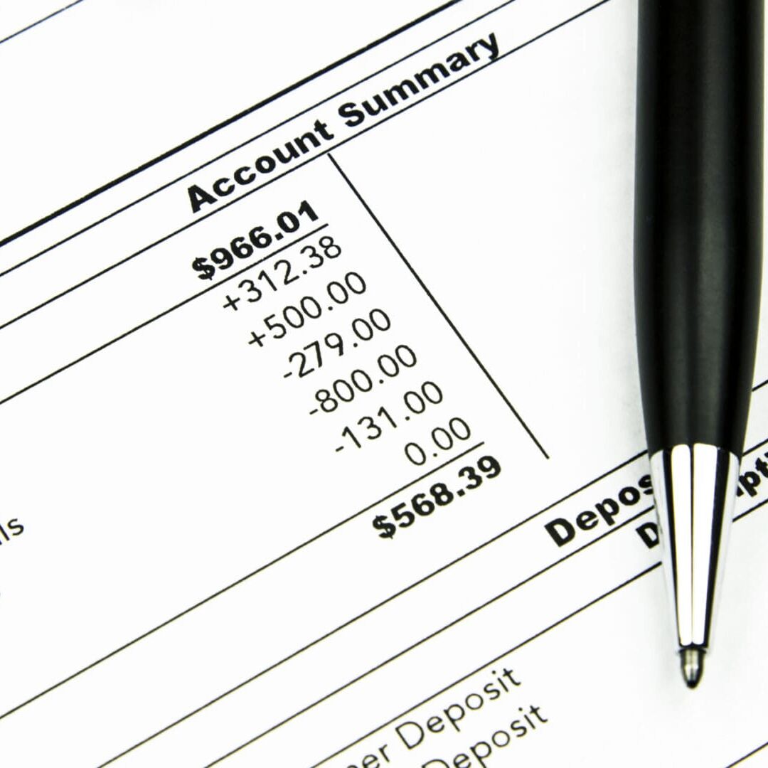 A pen resting on a financial statement showing Residential Programs US account summary figures. A pen resting on a financial statement showing Residential Programs US account summary figures.