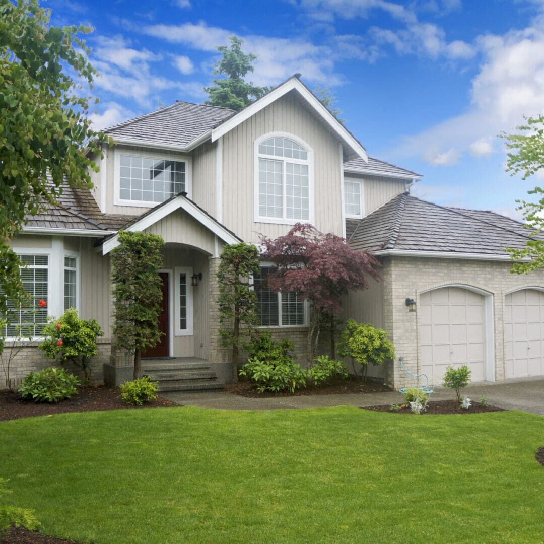 A two-story suburban house with a double garage, a landscaped front yard, and designated for residential programs in the US. A two-story suburban house with a double garage, a landscaped front yard, and designated for residential programs in the US.