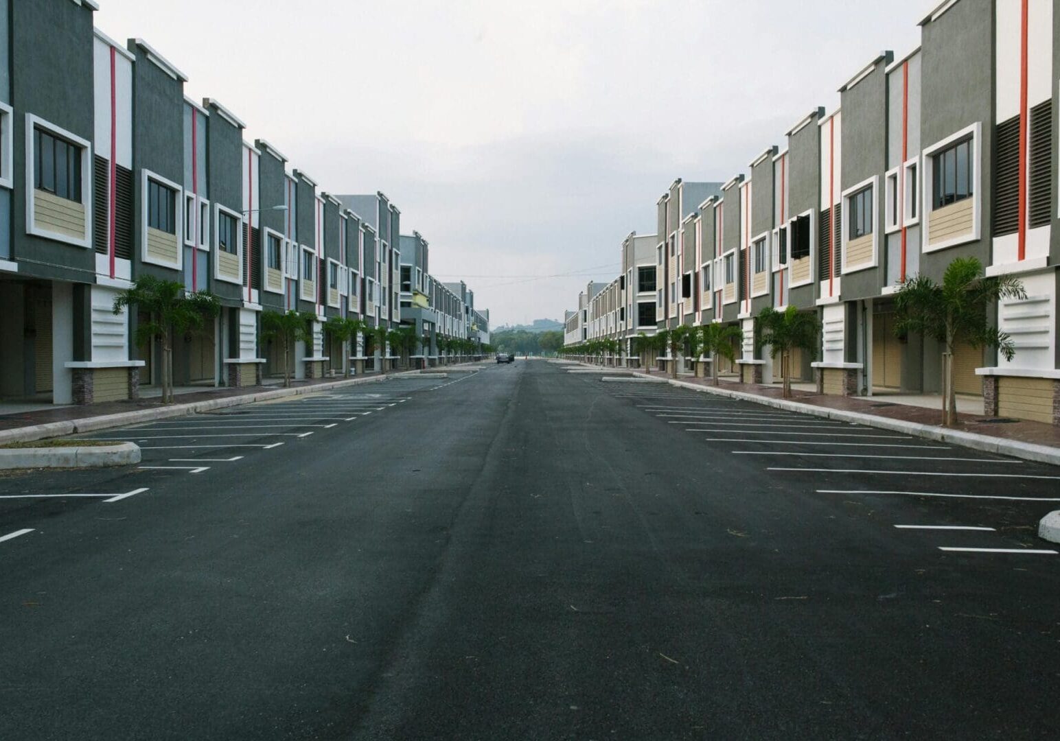 Empty street between modern townhouses.